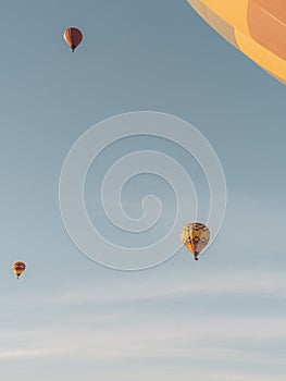 Parachutes flying up in the air during daytime