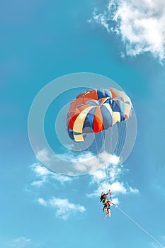 Parachuting above the clouds.  blue sky