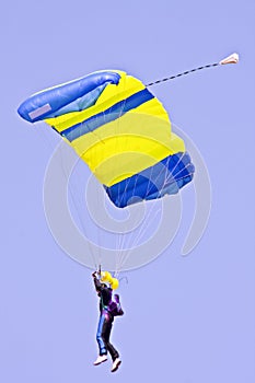 Parachuting against a blue sky