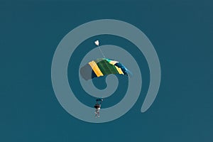 parachuting against blue sky - freedom and adrenaline concept