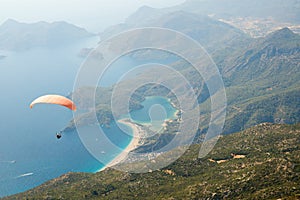 Parachuting over seascape photo