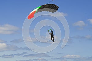 Parachutist in the blue sky