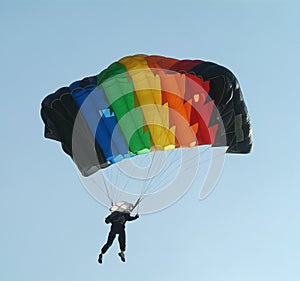 Parachutist with colourful parachute photo