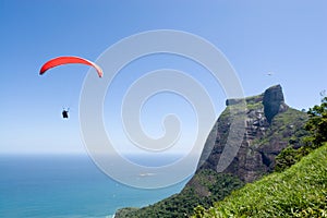 Parachutist over coast photo