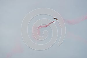 Parachutist in the sky on a cloudy day