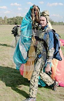 The parachutist transfers a parachute