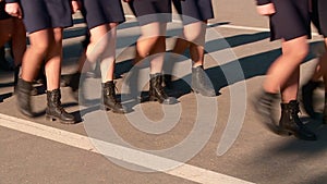 Parade of military women and men legs in the frame marching