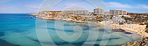 Paradise bay seascape panorama with azure water at Ghajn Tuffieha, Malta