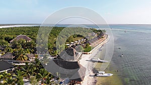 Paradise Coast Resort with Palm Trees and Hotels by Ocean, Zanzibar, Aerial view