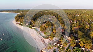 Paradise Coast Resort with Palm Trees and Hotels by Ocean, Zanzibar, Aerial view