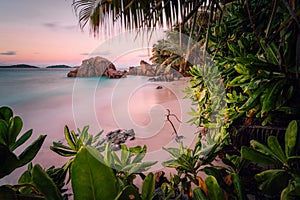 Paradise exotic beach on La Digue Island, Seychelles. Long Exposure during amazing sunset