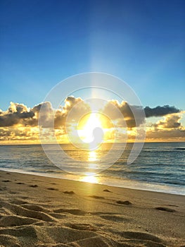 Paradise Glorious golden sunrise over the beach in Kauai Hawaii