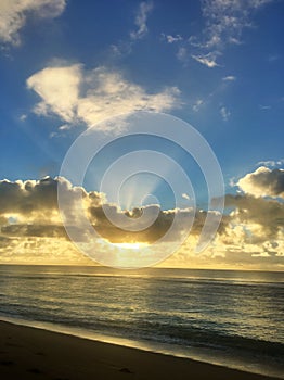 Paradise Glorious golden sunrise over the beach in Kauai Hawaii