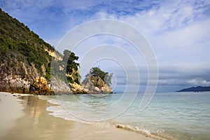 Paradise sea landscape with white sand and emerald ocean shore in Rawa Island Malaysia