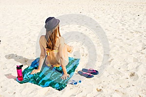 Paradise summer vacation happiness carefree happy woman relaxing sitting in sand enjoying tropical beach destination