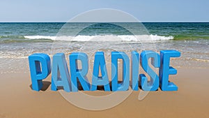 Paradise word on a beach