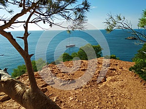 Paradisiacal and breathtaking cliff. bright and bright colors. from the height of Cala D`hort you can see the crystalline Ibizan