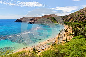 Paradisial beach with unrecognizable people at Hanauma Bay, Oahu, Hawaii