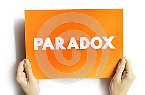 Paradox is a logically self-contradictory statement or a statement that runs contrary to one\'s expectation photo
