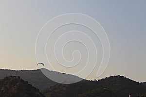 Paraglide against the background of mountains