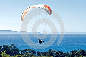 Paraglider above the Pacific Ocean