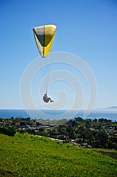 Paraglider above the Pacific Ocean