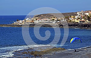 Paraglider on the beach La Enramada in south Tenerife island,Canary islands,Spain. photo