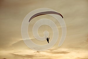 Paraglider flies on background of the sky