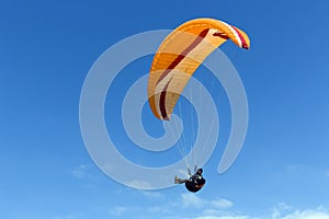 Paraglider flying above Mediterranean