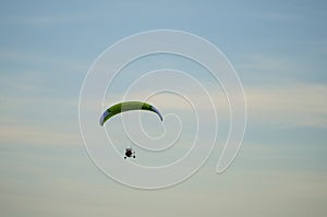 Paraglider flying free in the sky