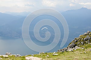 Paraglider is flying in front of mountain landscape of Alps - Mo