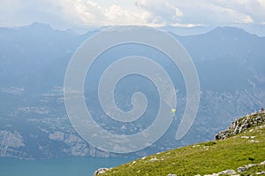 Paraglider is flying in front of mountain landscape of Alps - Mo