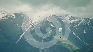 Paraglider flying in the mountains in georgia