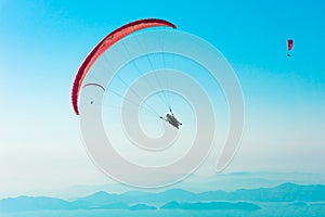 Paraglider flying on Oludeniz beach in Fethiye, Mugla, Travel destination. Summer and holiday concept