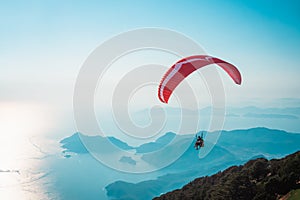 Paraglider flying on Oludeniz beach in Fethiye, Mugla. Travel destination. Summer and holiday concept