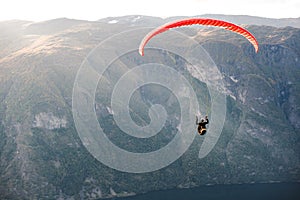 Paraglider flying over Aurlandfjord, Norway