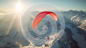 Paraglider flying over snow-covered mountains at sunrise
