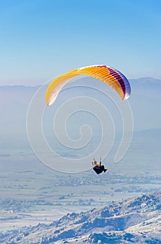 Paraglider flying in the sky