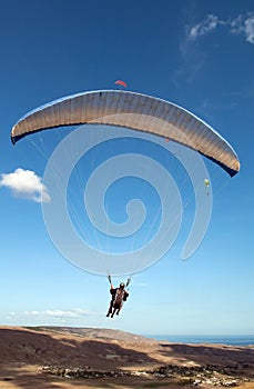 Paraglider flying in the sky