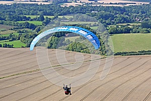 Paraglider flying at Combe Gibbet, England photo