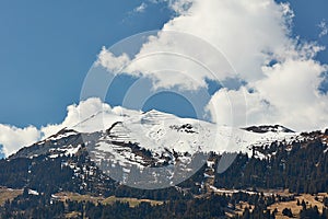 Paraglider and glider over snowy peaks of Vilan massif