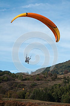 Paraglider going to land in a field