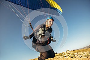 Paraglider on the ground  prepairs to fly