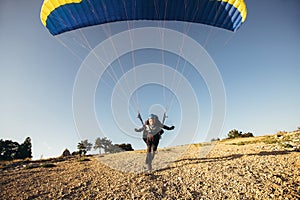 Paraglider on the ground  prepairs to fly