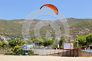 Paraglider landing in a special zone at Cleopatra Beach in Alanya Turkey