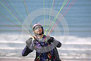 Paraglider launching above Rhossili