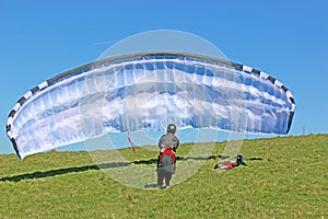 Paraglider launching at Milk Hill, Wiltshire