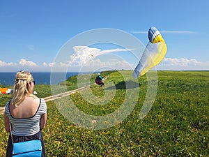 Paraglider near cliff along baltic sea coastline