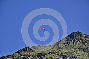 Paraglider over the mountains