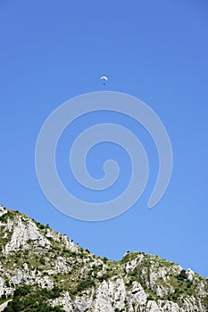 Paraglider over Piatra Secuiului Mountain (1129m), Transylvania, Romania, Europe photo